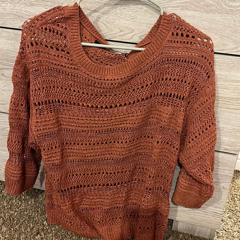 Burnt orange sweater.